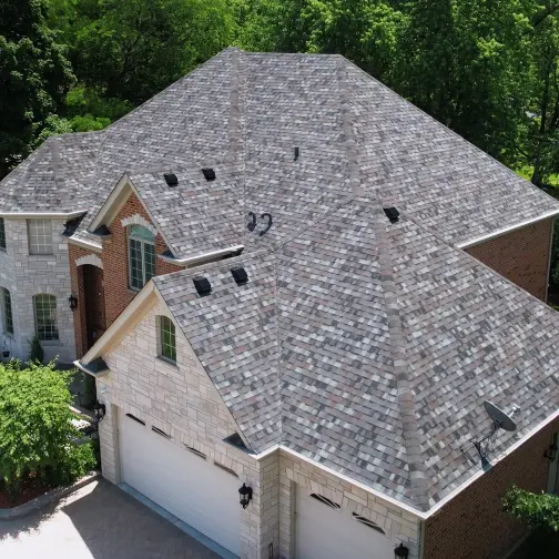 Brick home with newly replaced Arcitectural shingles