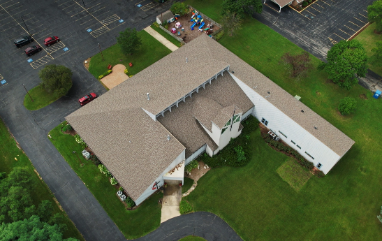 Aerial view of a business' roof replaced by 3JM Exteriors. 