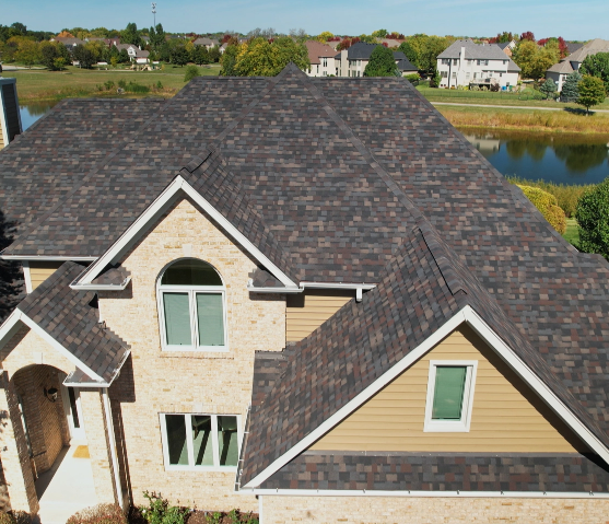 close up view of pondside home with new roof courtesy of 3JM Exteriors
