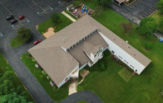 Aerial view of a churchs' roof replaced by 3JM Exteriors. 